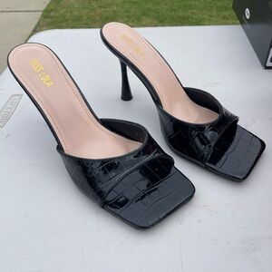Miss Lola Black Croc-Patterned Mules